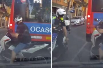 Un motorista intenta adelantar a un autobús en un semáforo en rojo en Barcelona con línea continua, pero se lleva una sorpresa al ver que de frente viene la Guàrdia Urbana: “Métete en contradirección, claro”